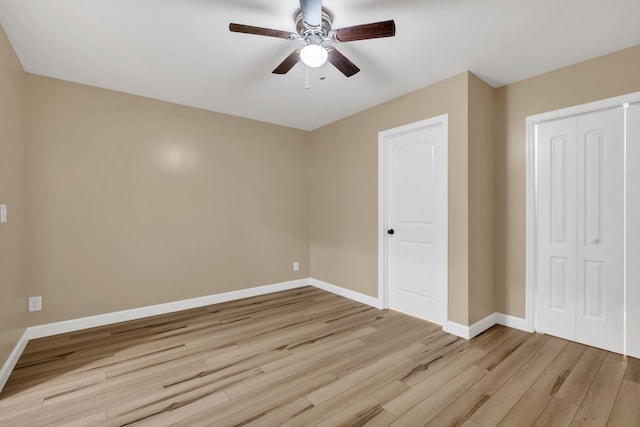 unfurnished bedroom featuring ceiling fan and light hardwood / wood-style flooring