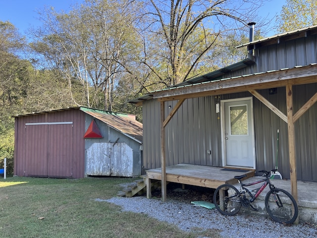 view of outbuilding with a lawn