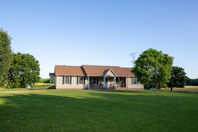 ranch-style home featuring a front yard and a porch