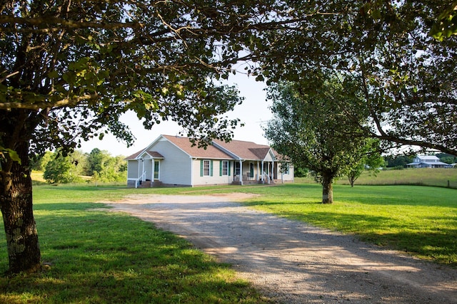 single story home featuring a front lawn