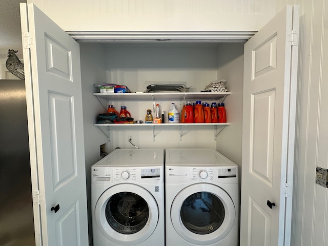 laundry area with washing machine and dryer