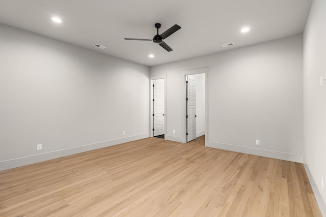 spare room featuring light hardwood / wood-style floors and ceiling fan