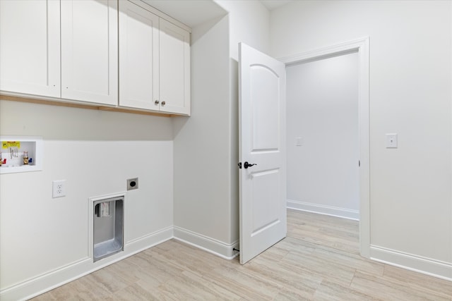 washroom with electric dryer hookup, light wood-type flooring, hookup for a washing machine, and cabinets