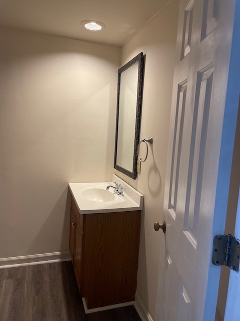 bathroom featuring vanity and hardwood / wood-style flooring