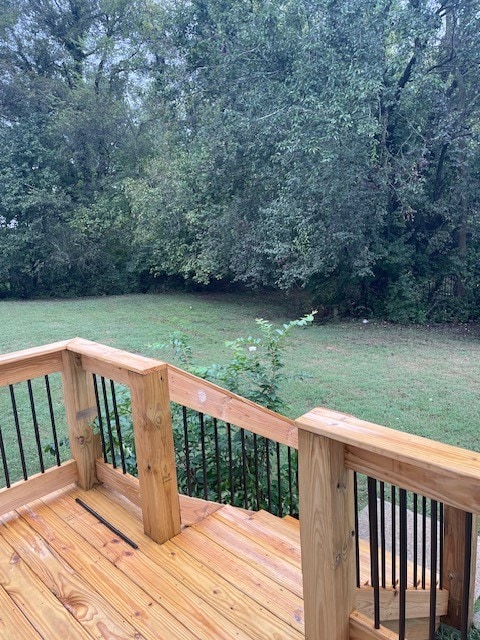 wooden deck with a yard