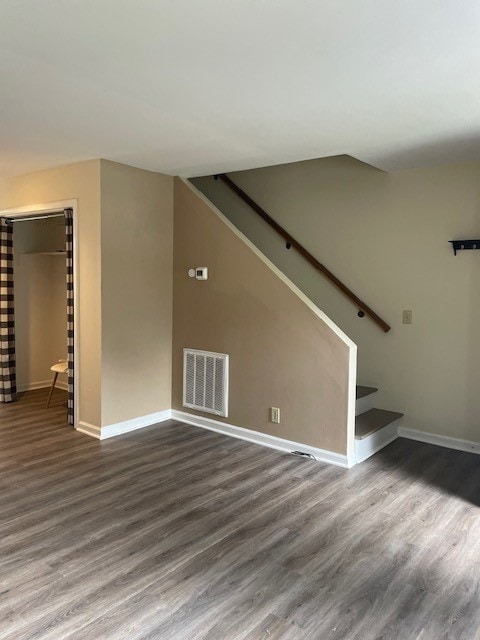 unfurnished living room with hardwood / wood-style flooring