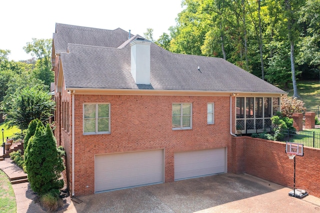 view of side of property with a garage