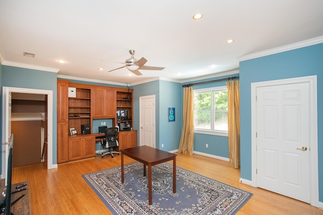 home office with ceiling fan, light wood-type flooring, and ornamental molding