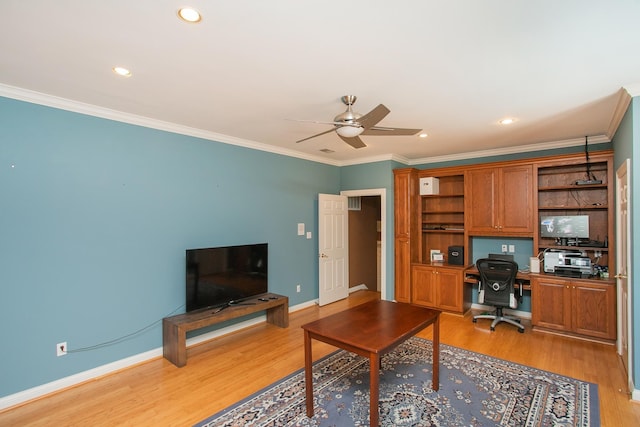 office space featuring ceiling fan, light wood-type flooring, and ornamental molding