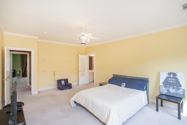 bedroom featuring crown molding, ceiling fan, carpet floors, and connected bathroom