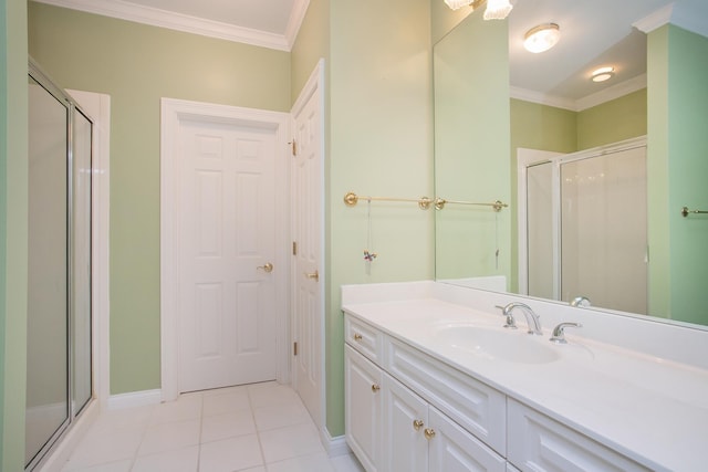 bathroom with crown molding, tile patterned flooring, vanity, and a shower with shower door