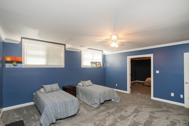 carpeted bedroom with ceiling fan and ornamental molding