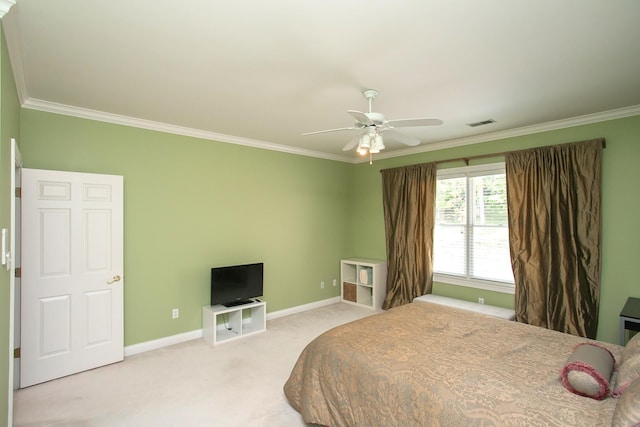 carpeted bedroom with ceiling fan and crown molding