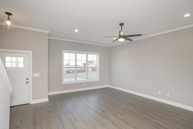 entryway with ornamental molding, dark hardwood / wood-style flooring, and ceiling fan