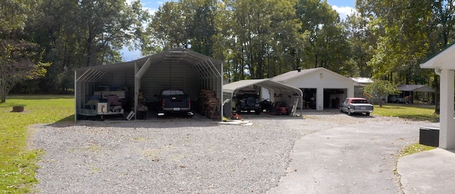 view of outdoor structure featuring a yard, a garage, and a carport