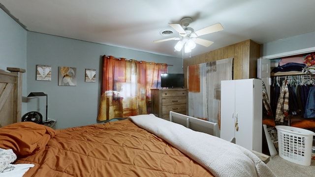 carpeted bedroom featuring a closet and ceiling fan