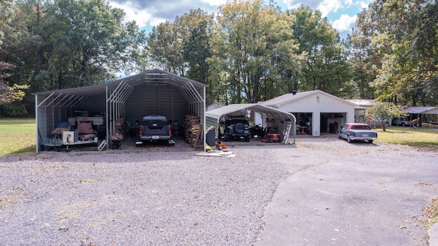 view of vehicle parking featuring a carport and a lawn