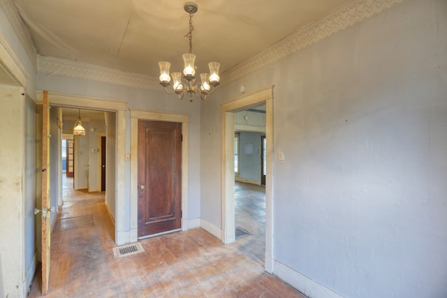 unfurnished dining area featuring an inviting chandelier