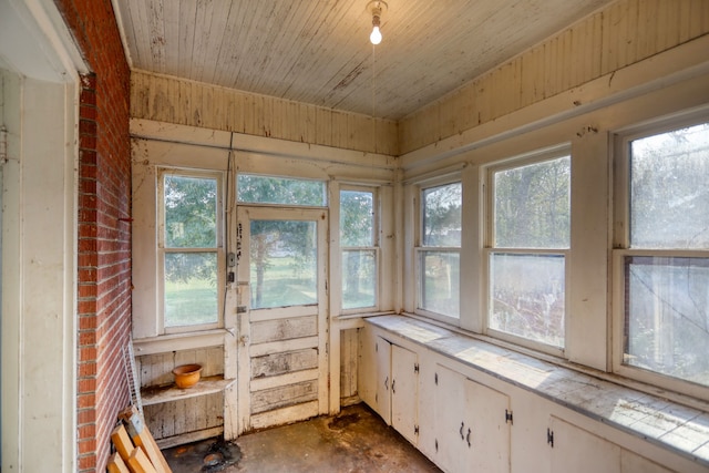 sunroom with a wealth of natural light and wooden ceiling