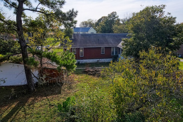 exterior space with brick siding