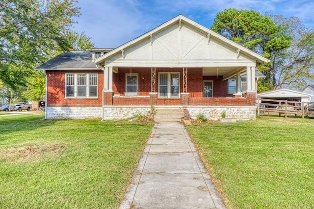 bungalow-style house with a front yard and a porch