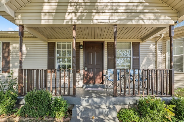 doorway to property featuring covered porch