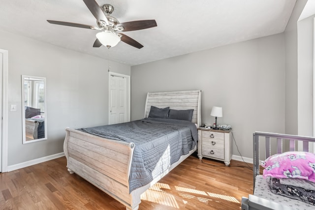 bedroom featuring wood-type flooring and ceiling fan