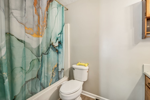 full bathroom featuring wood-type flooring, shower / bath combo with shower curtain, vanity, and toilet