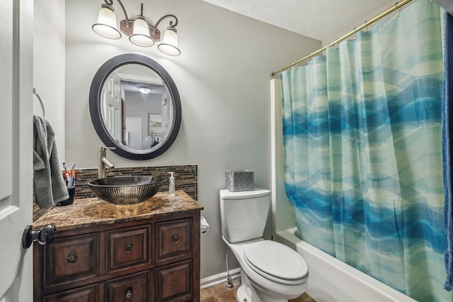 full bathroom featuring vanity, shower / bath combo, a textured ceiling, tile patterned floors, and toilet