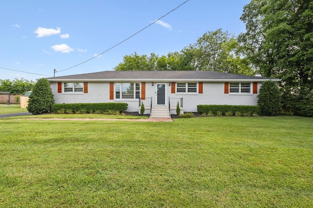 ranch-style home with a front lawn