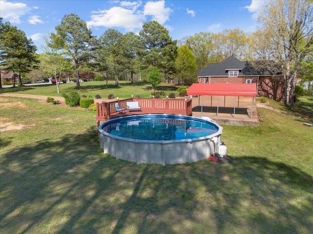 view of swimming pool featuring a gazebo, a yard, and a wooden deck