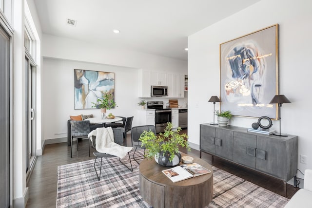 living room with dark hardwood / wood-style floors