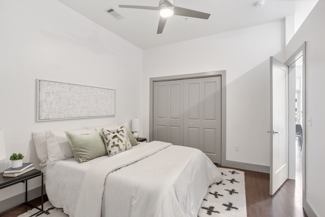 bedroom with ceiling fan, a closet, and hardwood / wood-style floors