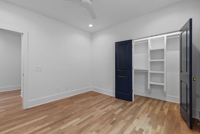 unfurnished bedroom with ceiling fan, a closet, and light hardwood / wood-style flooring