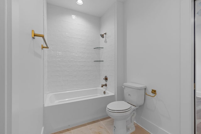 bathroom featuring tile patterned floors, shower / bathtub combination, and toilet