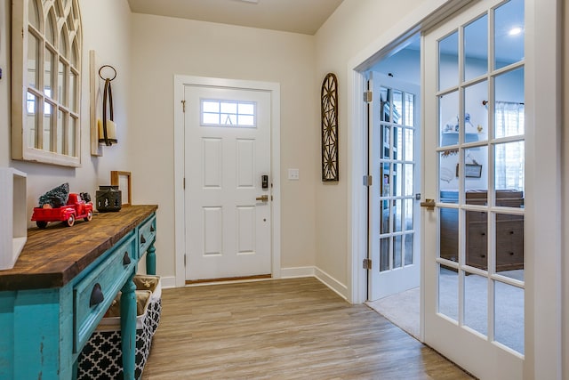 foyer with light hardwood / wood-style flooring