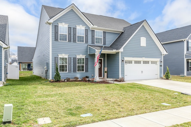 view of front of home featuring a garage and a front lawn