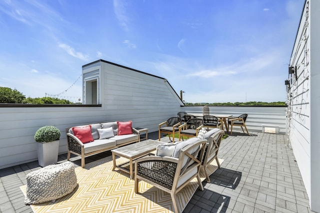 view of patio featuring an outdoor hangout area and a water view