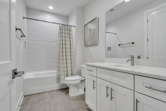 full bathroom with shower / bath combination with curtain, vanity, tile patterned flooring, and toilet