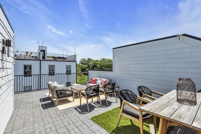 view of patio / terrace featuring outdoor lounge area and a balcony