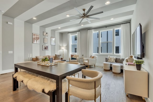 dining room with light hardwood / wood-style flooring and ceiling fan