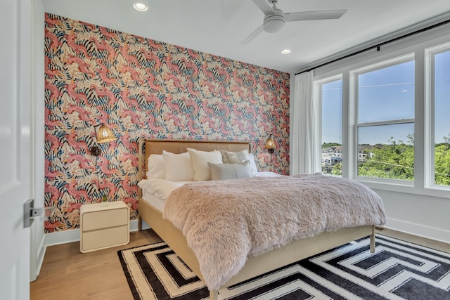 bedroom featuring light wood-type flooring and ceiling fan