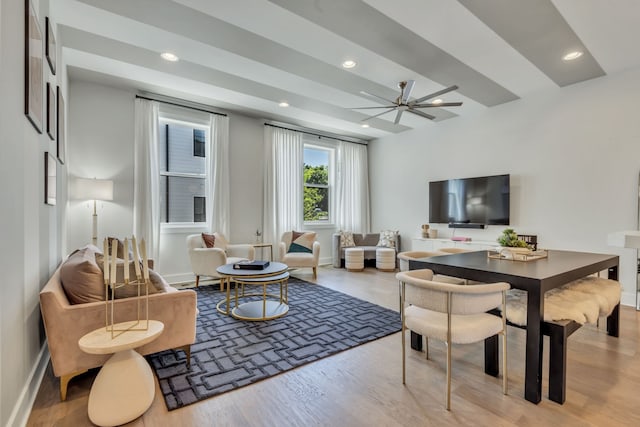 living room with light wood-type flooring and ceiling fan