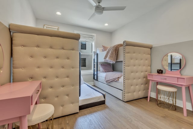 bedroom with ceiling fan and light hardwood / wood-style flooring