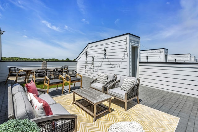 view of patio / terrace with an outdoor living space and a water view