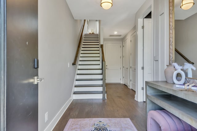 foyer entrance with dark wood-type flooring