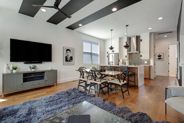 dining room featuring light wood-type flooring and ceiling fan