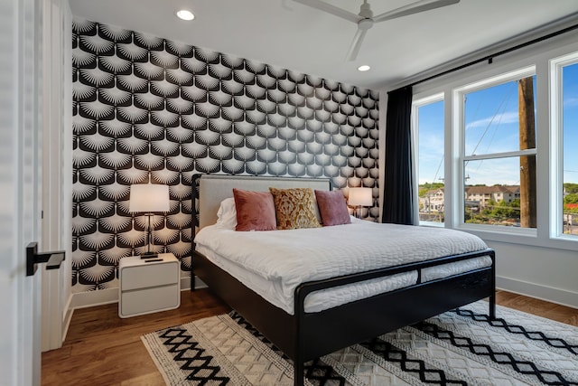 bedroom featuring hardwood / wood-style flooring and ceiling fan