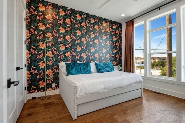 2176 Carson St Unit 23, Nashville, TN 37211 - bedroom featuring wallpapered walls, wood finished floors, recessed lighting, an accent wall, and a ceiling fan