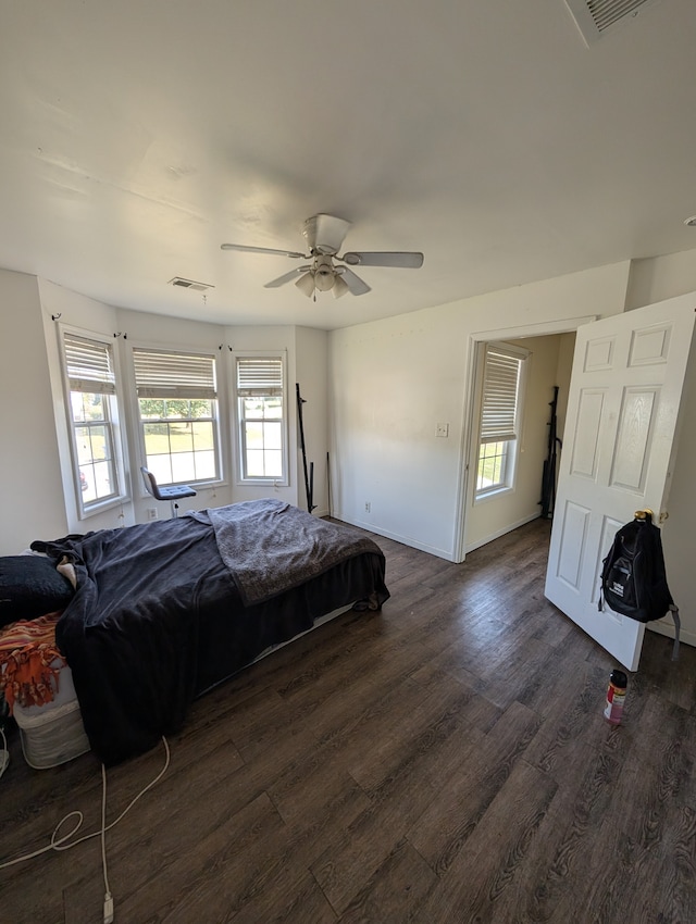 bedroom featuring dark hardwood / wood-style floors and ceiling fan